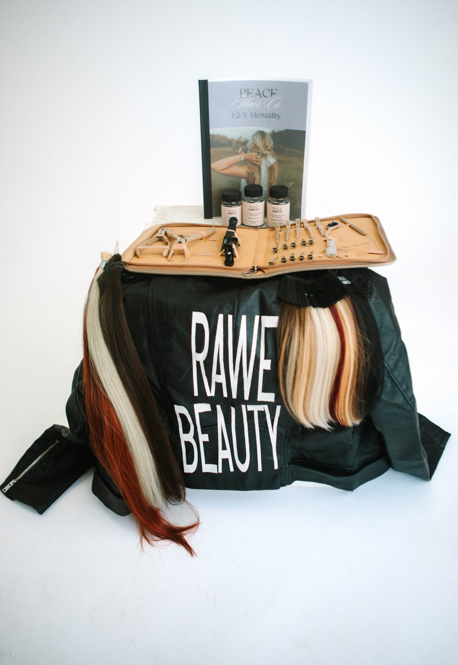 EA7A5705-2 A table with a "Rawe Beauty" logo on the black tablecloth